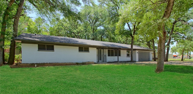3404 Alhambra Dr, Forest Hill, TX 76119 - single story home with an attached garage, brick siding, a front yard, and driveway