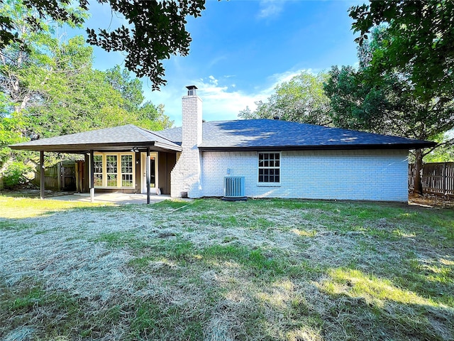 2946 Ridgewood Dr, Grapevine, TX 76051 - rear view of property featuring central air condition unit, a chimney, a patio, and brick siding