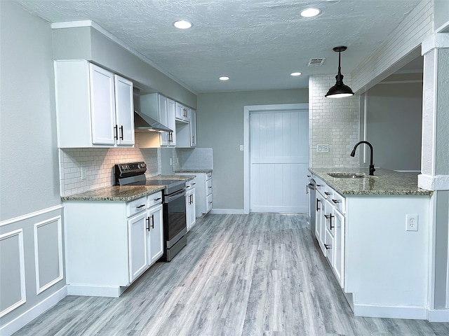 2946 Ridgewood Dr, Grapevine, TX 76051 - kitchen with electric range oven, stone counters, a sink, tasteful backsplash, and a textured ceiling