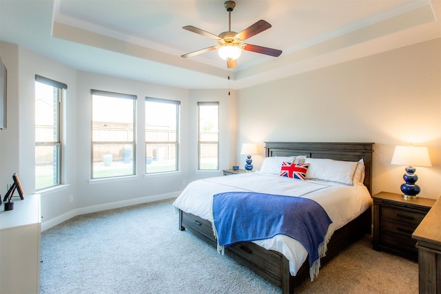 7721 Haddington, The Colony, TX 75056 - bedroom featuring a raised ceiling, light colored carpet, multiple windows, and ornamental molding
