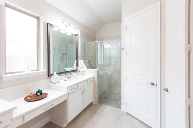 7721 Haddington, The Colony, TX 75056 - full bathroom with vanity, a shower stall, lofted ceiling, and tile patterned floors