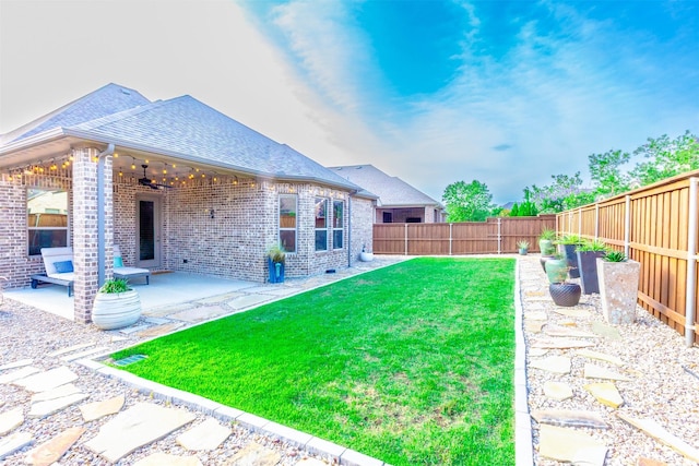 7721 Haddington, The Colony, TX 75056 - view of yard featuring a ceiling fan and a patio area