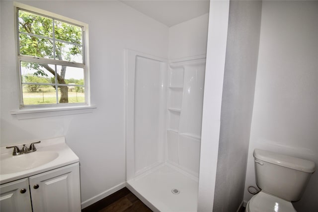 5604 5th St, Rochelle, TX 76872 - full bathroom with a shower stall, plenty of natural light, vanity, and toilet