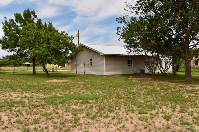 5604 5th St, Rochelle, TX 76872 - view of grassy yard featuring central AC unit