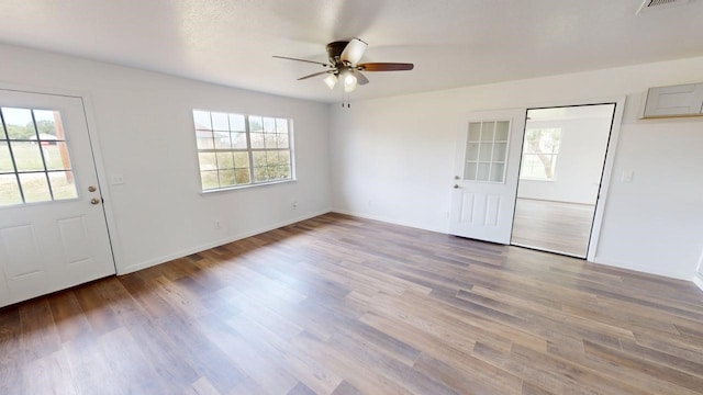 5604 5th St, Rochelle, TX 76872 - foyer entrance with ceiling fan, wood finished floors, and baseboards