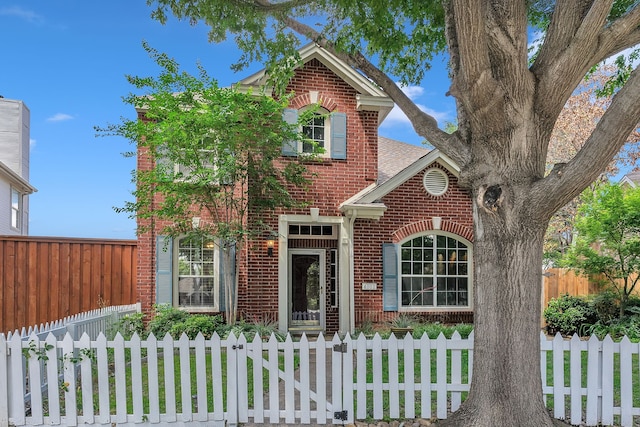 4001 Elmhill Dr, Plano, TX 75024 - traditional home with brick siding, a fenced front yard, and a shingled roof