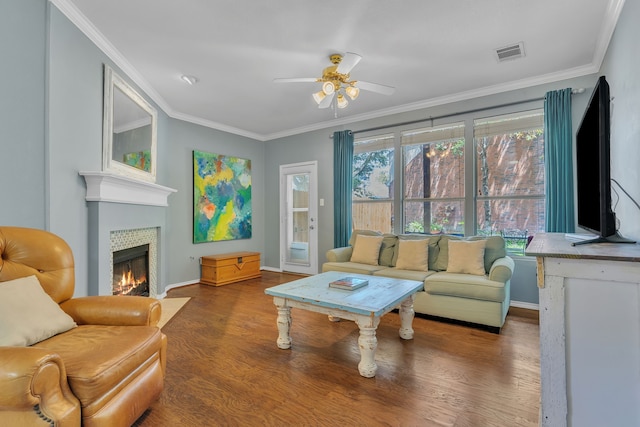 4001 Elmhill Dr, Plano, TX 75024 - living area with wood finished floors, ceiling fan, baseboards, a fireplace, and crown molding