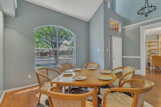 4001 Elmhill Dr, Plano, TX 75024 - dining space with high vaulted ceiling, wood finished floors, and baseboards
