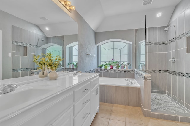 4001 Elmhill Dr, Plano, TX 75024 - full bath featuring a garden tub, lofted ceiling, tiled shower, double vanity, and tile patterned floors