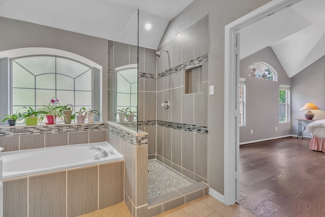 4001 Elmhill Dr, Plano, TX 75024 - ensuite bathroom featuring vaulted ceiling, a walk in shower, and a garden tub