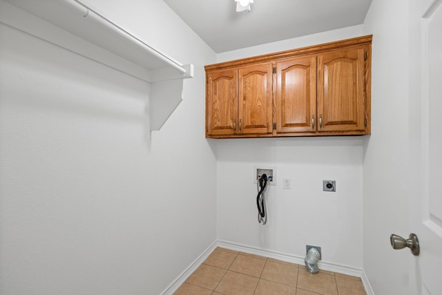 623 Madison Pl, Sherman, TX 75092 - laundry room featuring electric dryer hookup, washer hookup, baseboards, light tile patterned floors, and cabinet space