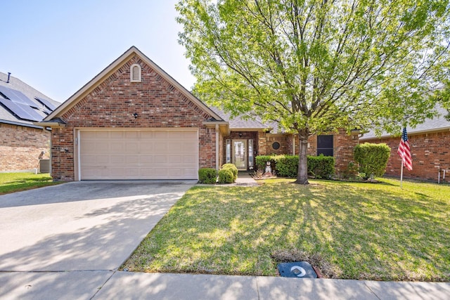 623 Madison Pl, Sherman, TX 75092 - view of front of property with a front yard, concrete driveway, an attached garage, and brick siding