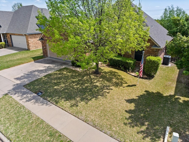 623 Madison Pl, Sherman, TX 75092 - view of front of house featuring brick siding, concrete driveway, and a front yard
