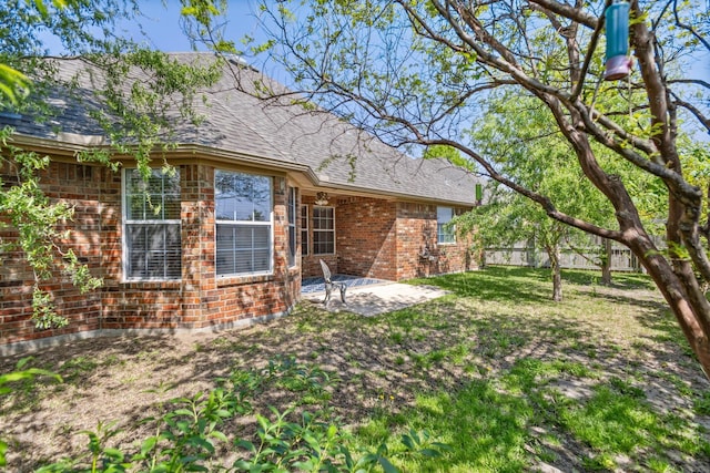 623 Madison Pl, Sherman, TX 75092 - rear view of property with a patio area, brick siding, and roof with shingles