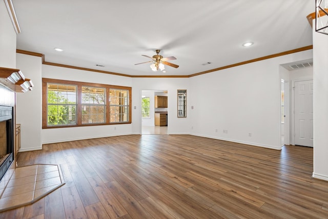 623 Madison Pl, Sherman, TX 75092 - unfurnished living room with a ceiling fan, plenty of natural light, a fireplace, baseboards, and ornamental molding