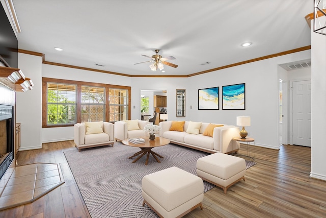 623 Madison Pl, Sherman, TX 75092 - living room featuring wood finished floors, a ceiling fan, baseboards, recessed lighting, and ornamental molding
