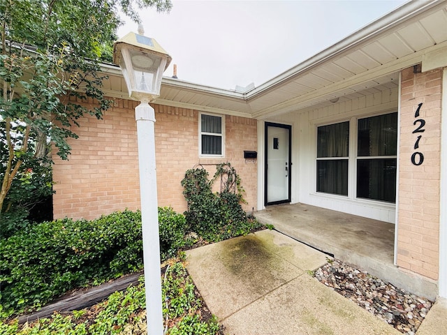 1210 Carroll Dr, Garland, TX 75041 - doorway to property featuring brick siding