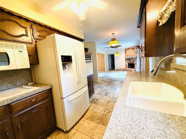 1210 Carroll Dr, Garland, TX 75041 - kitchen featuring white appliances, ceiling fan, a sink, decorative backsplash, and light countertops