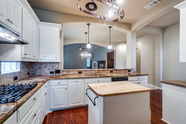 209 Pine Valley Ct, Fairview, TX 75069 - kitchen featuring a sink, wooden counters, black appliances, arched walkways, and dark wood-style floors