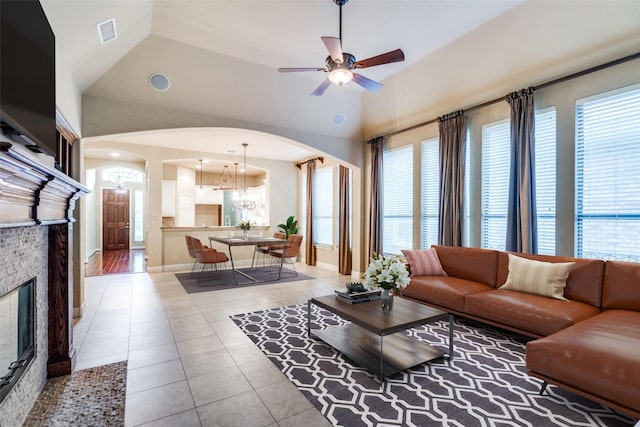 209 Pine Valley Ct, Fairview, TX 75069 - living area featuring arched walkways, light tile patterned flooring, and plenty of natural light