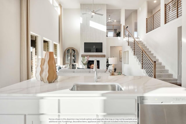 4622 Bel Air Dr, Midlothian, TX 76065 - kitchen with dishwasher, a towering ceiling, a sink, open floor plan, and ceiling fan