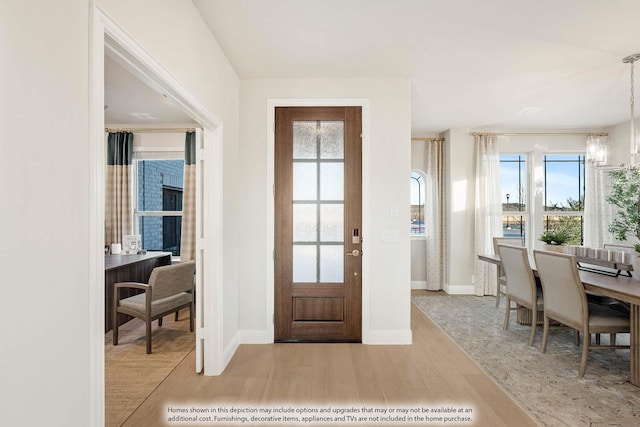 4622 Bel Air Dr, Midlothian, TX 76065 - entrance foyer featuring wood finished floors, a chandelier, and baseboards
