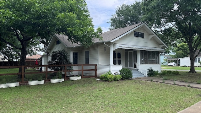 573 S Preston Ave, Van Alstyne, TX 75495 - view of front of house with a shingled roof and a sunroom