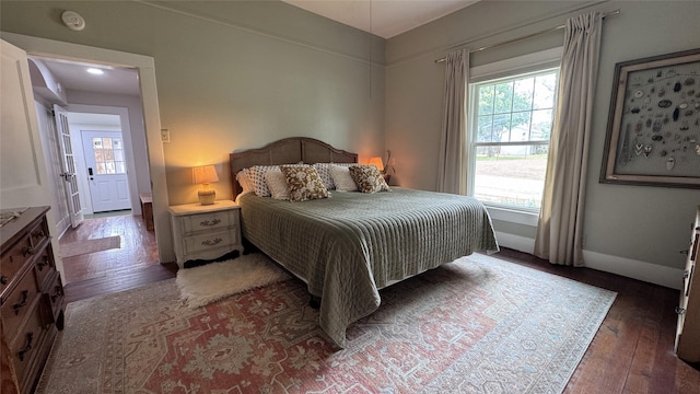 573 S Preston Ave, Van Alstyne, TX 75495 - bedroom with hardwood / wood-style flooring and baseboards