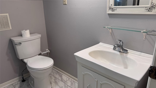 573 S Preston Ave, Van Alstyne, TX 75495 - half bathroom featuring marble look tiles, vanity, toilet, and baseboards
