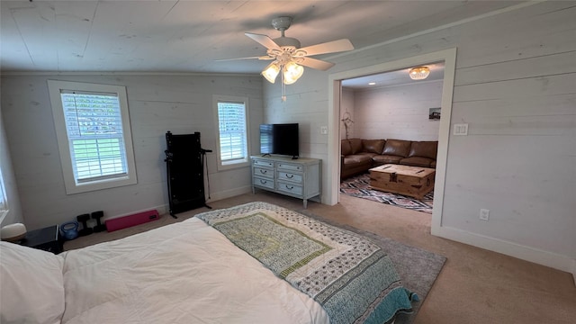 573 S Preston Ave, Van Alstyne, TX 75495 - carpeted bedroom with wooden walls, baseboards, and ceiling fan