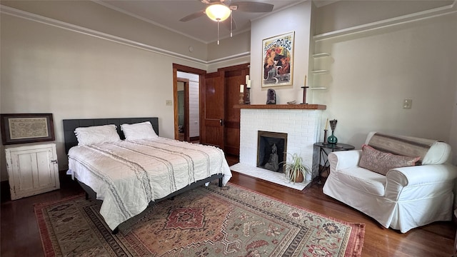 573 S Preston Ave, Van Alstyne, TX 75495 - bedroom with wood finished floors, a brick fireplace, crown molding, and a ceiling fan