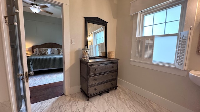 573 S Preston Ave, Van Alstyne, TX 75495 - bedroom featuring baseboards and light marble finish floors