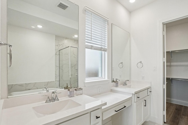 422 Firecrest Ln, Celina, TX 75009 - full bathroom featuring a marble finish shower, vanity, a garden tub, a walk in closet, and recessed lighting