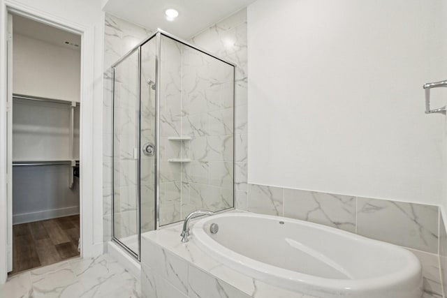 422 Firecrest Ln, Celina, TX 75009 - full bathroom featuring a garden tub, a marble finish shower, a walk in closet, marble look tiles, and recessed lighting