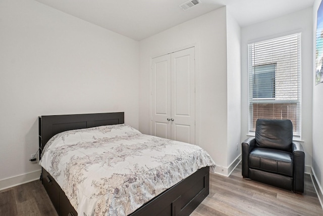 422 Firecrest Ln, Celina, TX 75009 - bedroom with a closet, baseboards, and wood finished floors