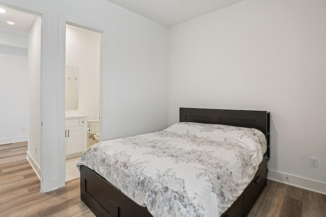 422 Firecrest Ln, Celina, TX 75009 - bedroom featuring wood finished floors, baseboards, and recessed lighting