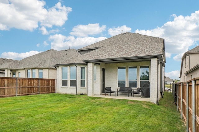 422 Firecrest Ln, Celina, TX 75009 - back of property with a shingled roof, a patio, and brick siding