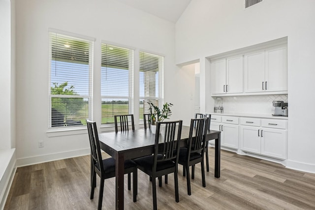 422 Firecrest Ln, Celina, TX 75009 - dining area with light wood-style flooring, baseboards, and high vaulted ceiling