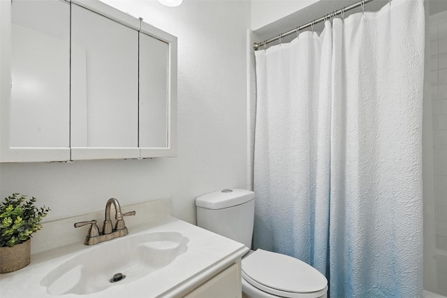 211 Cimarron Trl Unit 8, Irving, TX 75063 - bathroom featuring toilet and vanity