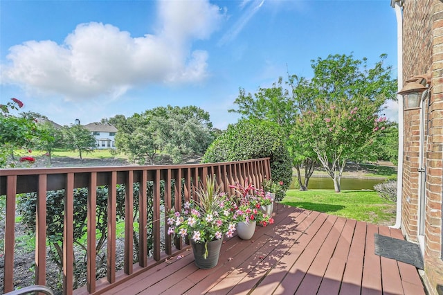 211 Cimarron Trl Unit 8, Irving, TX 75063 - deck featuring a water view and a lawn
