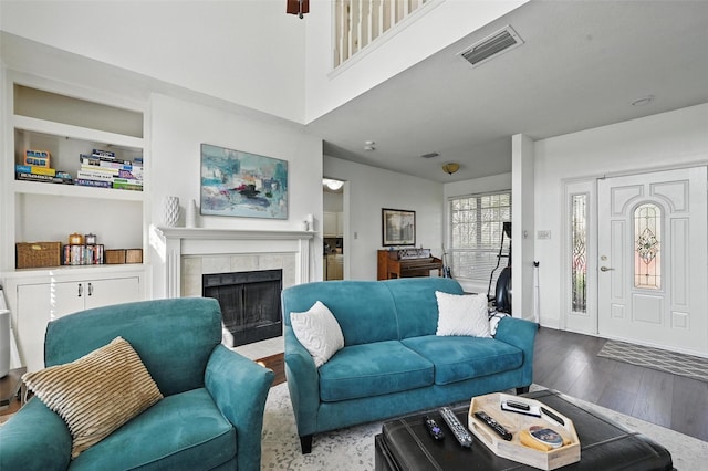 211 Cimarron Trl Unit 8, Irving, TX 75063 - living area featuring a fireplace and wood finished floors