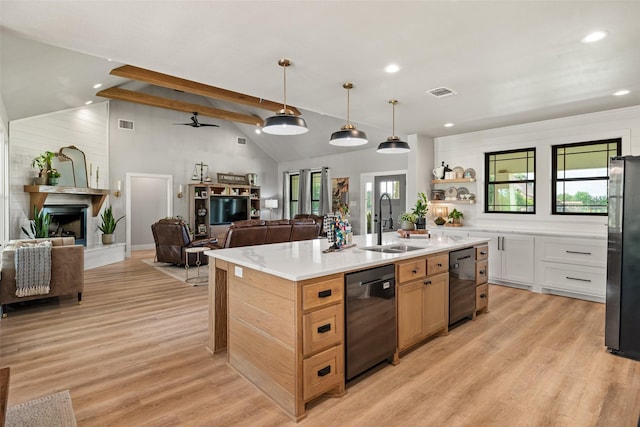 100 Tall Grass Ct, Weatherford, TX 76087 - kitchen with a sink, dishwasher, open floor plan, freestanding refrigerator, and recessed lighting