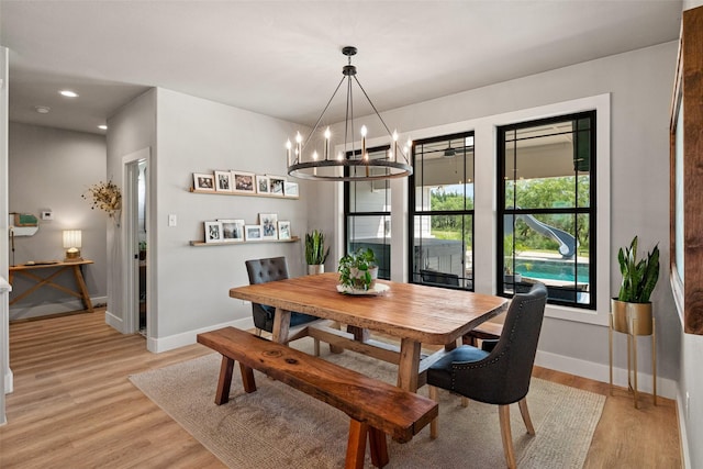 100 Tall Grass Ct, Weatherford, TX 76087 - dining room with baseboards, a chandelier, light wood-style floors, and recessed lighting