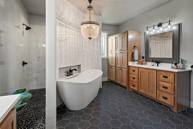 100 Tall Grass Ct, Weatherford, TX 76087 - bathroom featuring a freestanding bath, vanity, walk in shower, tile patterned floors, and a chandelier