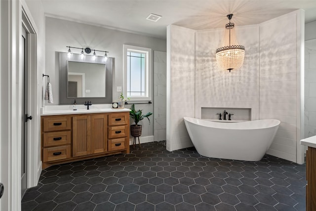 100 Tall Grass Ct, Weatherford, TX 76087 - full bath featuring vanity, a soaking tub, tile patterned floors, and a chandelier