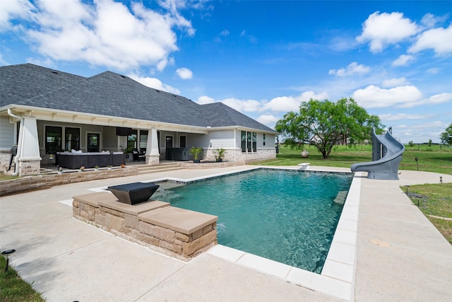 100 Tall Grass Ct, Weatherford, TX 76087 - swimming pool featuring a water slide, a patio area, and an outdoor hangout area