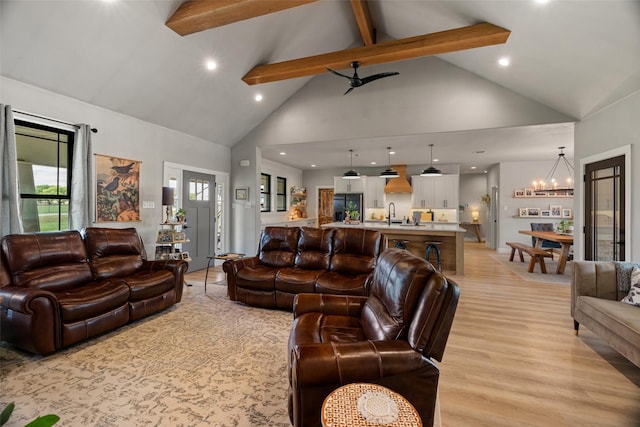 100 Tall Grass Ct, Weatherford, TX 76087 - living room with high vaulted ceiling, a chandelier, recessed lighting, beamed ceiling, and light wood-style flooring