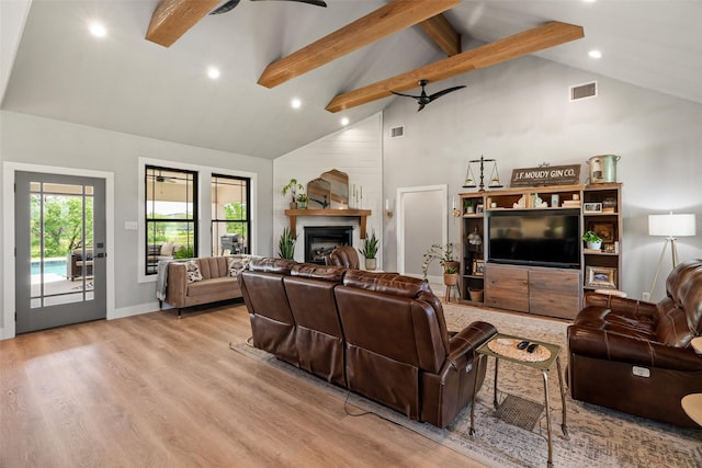 100 Tall Grass Ct, Weatherford, TX 76087 - living room with high vaulted ceiling, beamed ceiling, wood finished floors, recessed lighting, and a fireplace