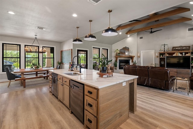 100 Tall Grass Ct, Weatherford, TX 76087 - kitchen with a sink, dishwasher, light wood finished floors, recessed lighting, and hanging light fixtures