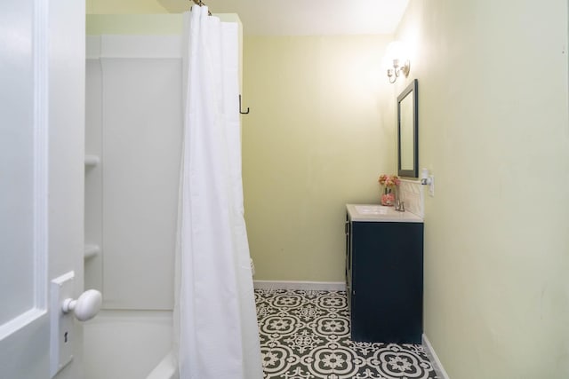 405 Houston St, Sulphur Springs, TX 75482 - bathroom featuring vanity, baseboards, and shower / bath combination with curtain